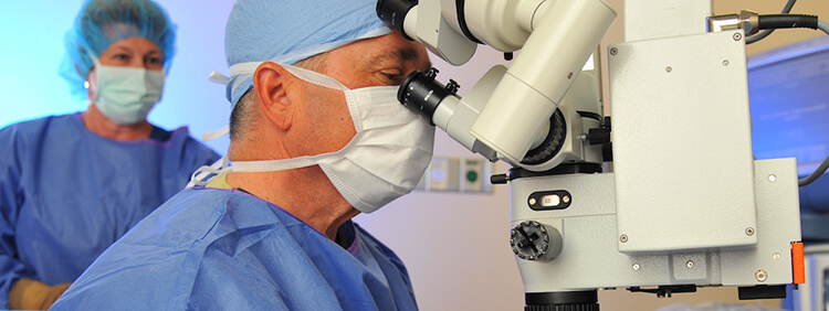 Ophthalmologist performing Retinal Detachment surgery