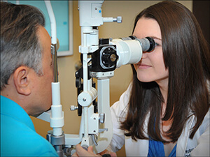 Robyn Glass, O.D. performing an eye exam