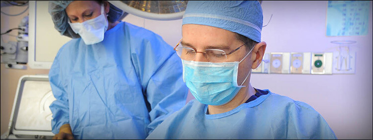 Ophthalmologist performing oculoplastic surgery