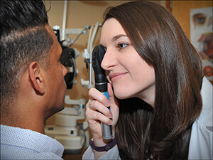 Orlando Optometrist Robyn Glass, O.D. performing an eye exam